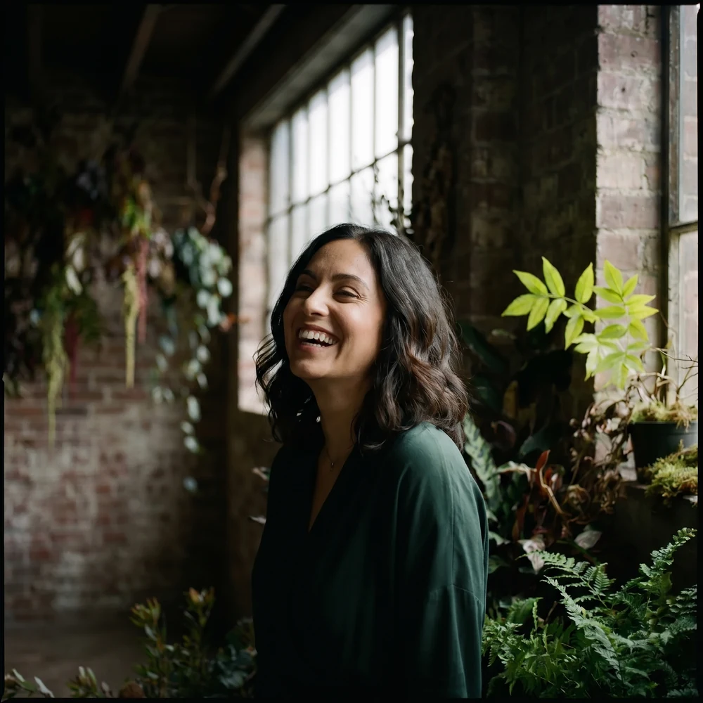 Mia laughing, hair catching the light