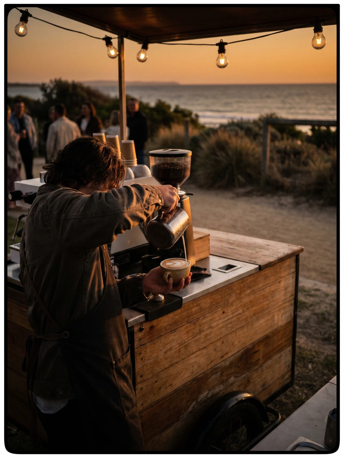 The Foredeck mobile coffee cart at a coastal event at golden hour