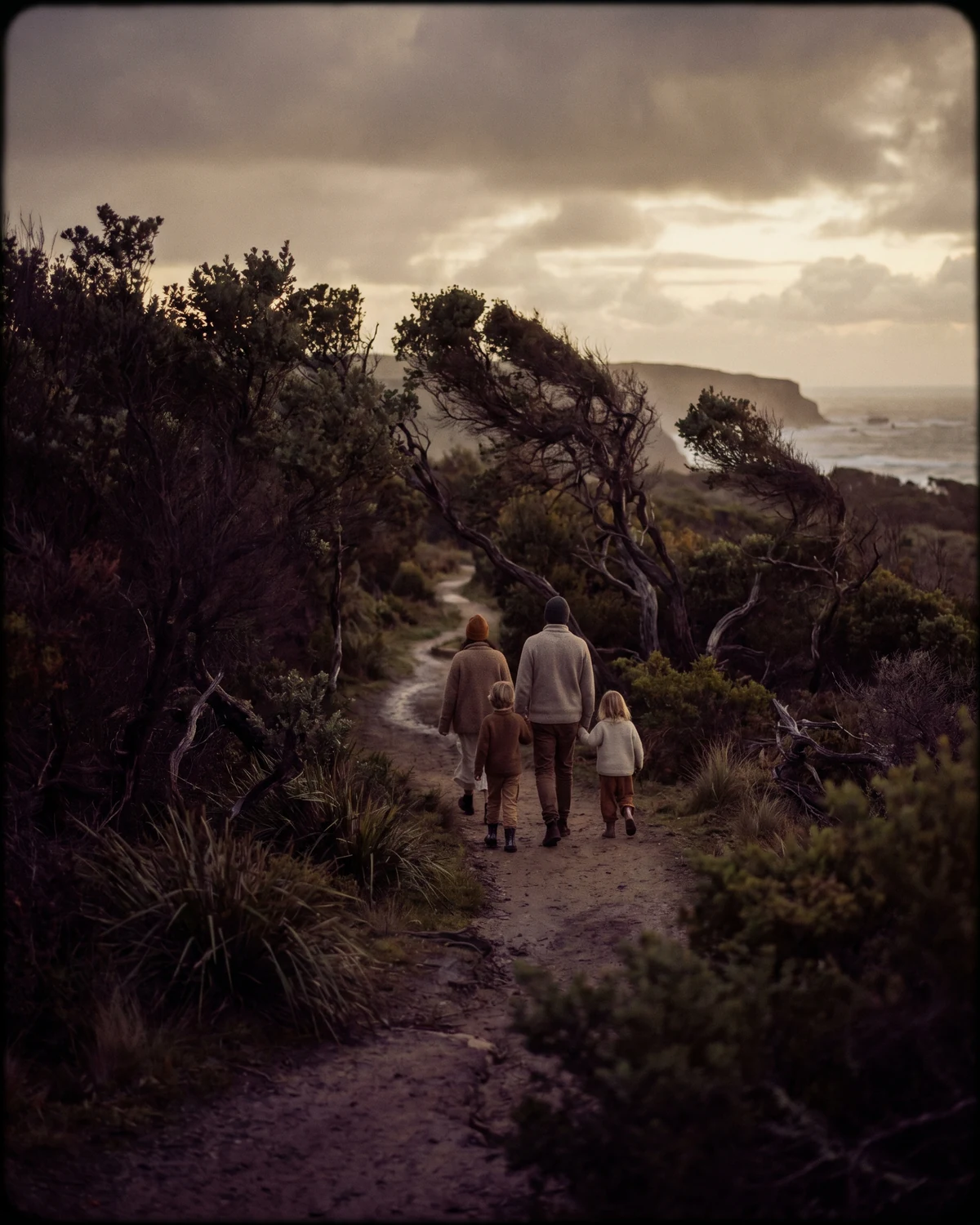 Family walking through Otways bushland at dusk