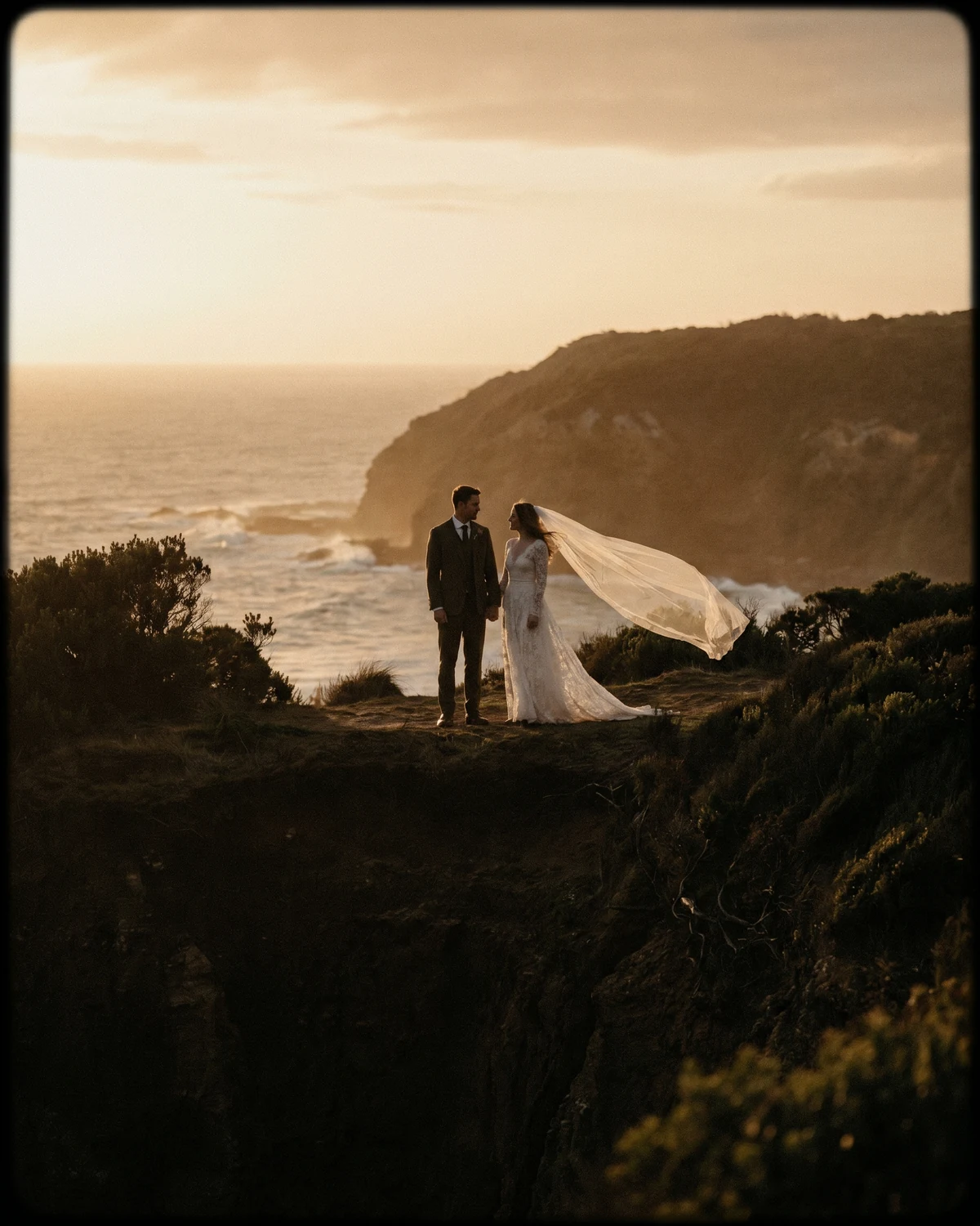 Bride and groom at golden hour on a Lorne clifftop